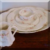 P37. 15 piece set of Warwick China including1 platter, 1 plate, creamer, 8 cups and 4 saucers. 3 Pieces are chipped. - $36 